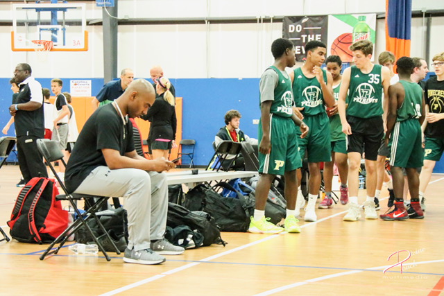 Quentin McDaniel courtside at a basketball tournament